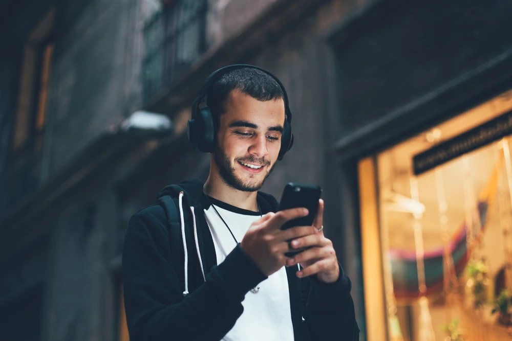 Person using a phone in a city